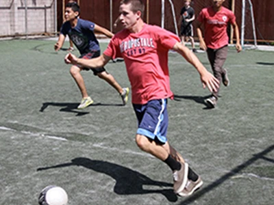 Male Student Playing Soccer Male Student Playing Soccer