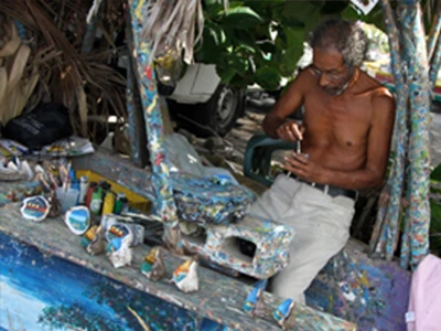 Man Painting Shells Man Painting Shells