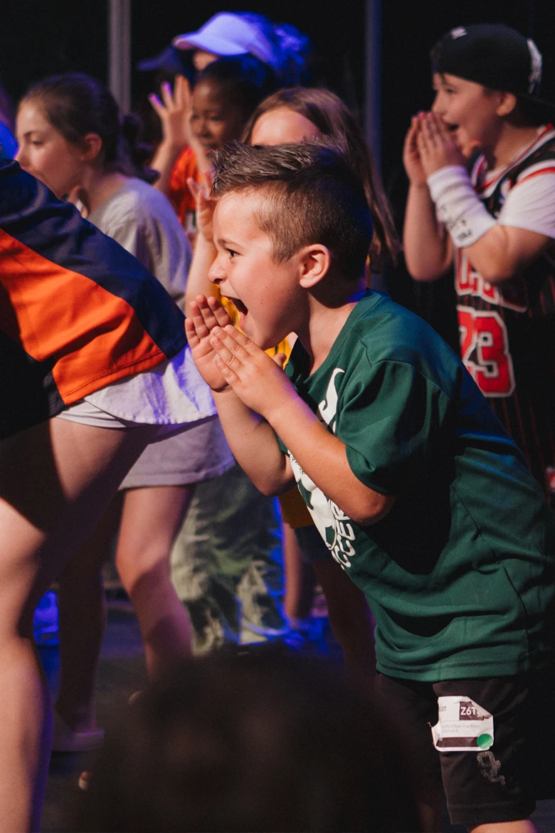 Group of girls sitting on grass smiling